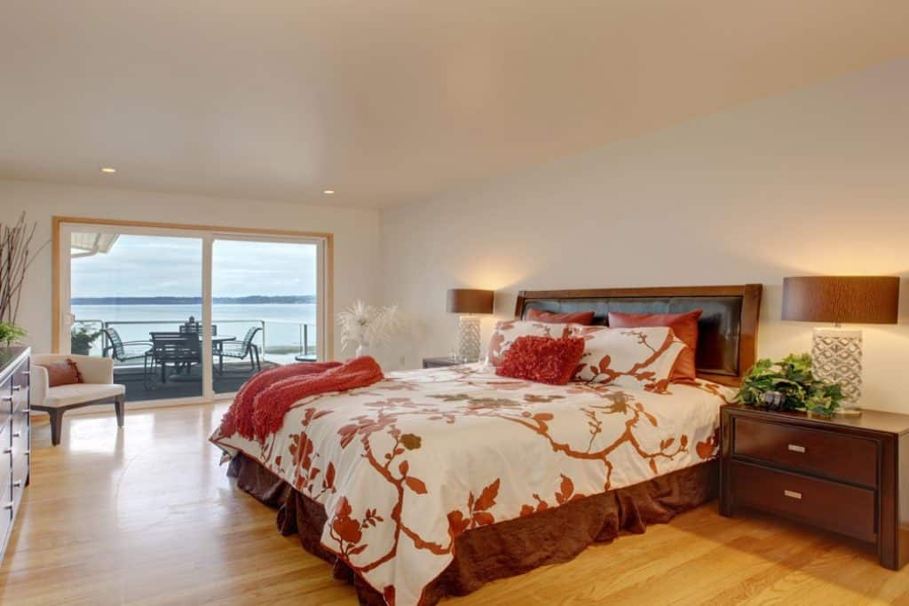 Romantic master bedroom interior with walkout deck - 101 Inspiring Master Bedroom Remodel Ideas & Pictures - HandyMan.Guide - Master Bedroom