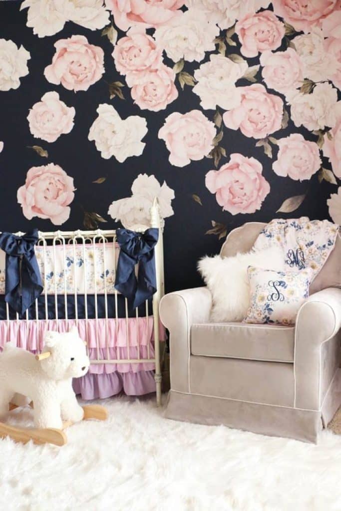 navy and pink peony floral nursery accent wall behind crib caden lane - 152 Baby Girl Nursery Ideas: Create Your Dream Baby Room with These - HandyMan.Guide - Baby Girl Nursery Ideas