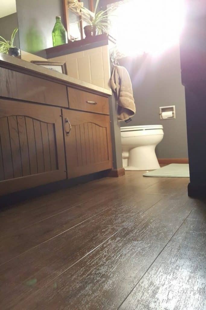luxury vinyl planked bathroom jakob morse flooring installation 1 - 152 Small Bathroom Remodel Ideas & Pictures for 2022 - HandyMan.Guide - Small Bathroom