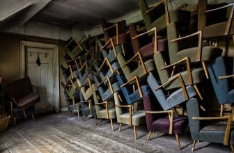 assorted armchair on wall near door