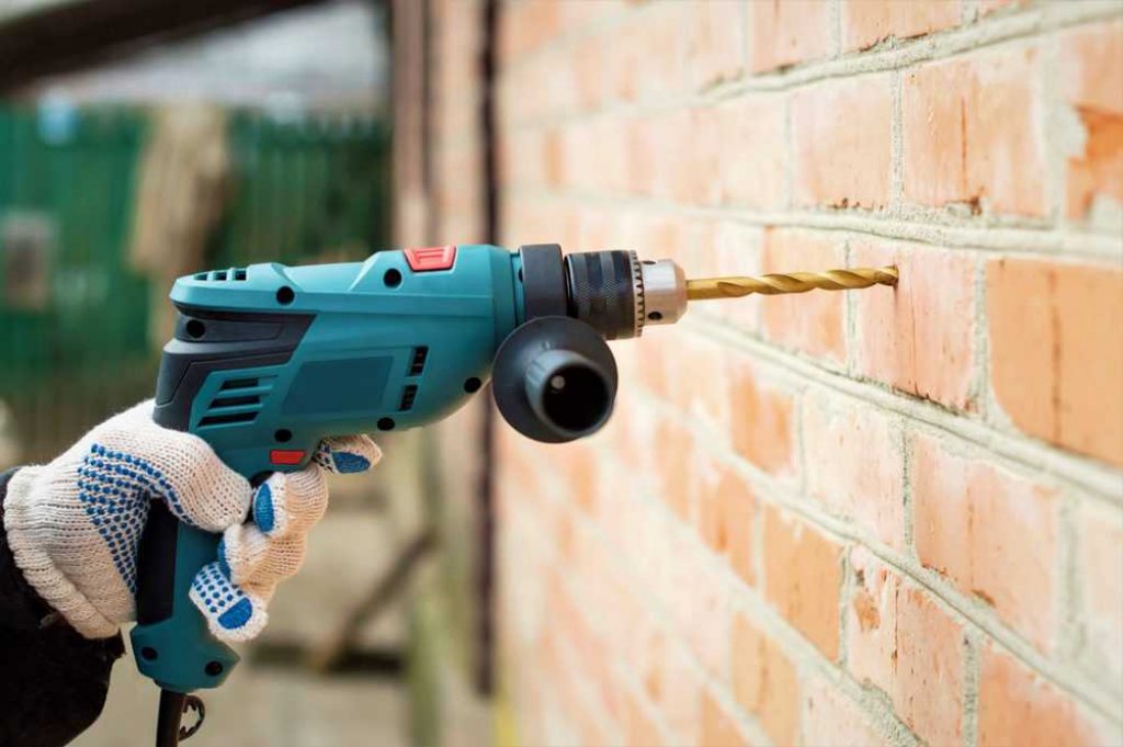 How To Drill Into Brick scaled 1 - How to Use an Impact Driver: Everything You Need to Know - HandyMan.Guide - How to Use an Impact Driver