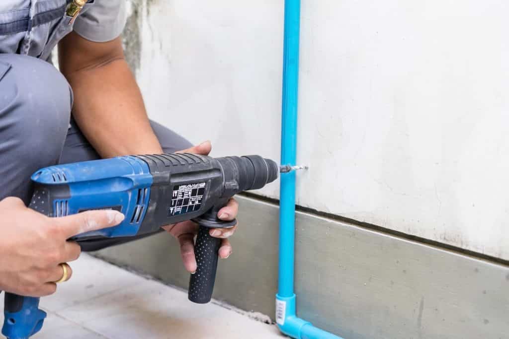 worker using a drilling power tool on construction site free photo - How to Use a Power Drill - Best Guide - HandyMan.Guide - How to Use a Power Drill